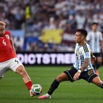 Lautaro Martínez battles for possession with Xaver Schlager