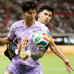 Jorge Sanchez battles for possession with Son Heung-min