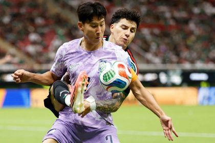 Jorge Sanchez battles for possession with Son Heung-min