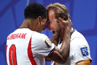 Harry Kane celebrates with Jude Bellingham