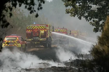 Firefighters extinguish remaining hotspots and smoldering areas