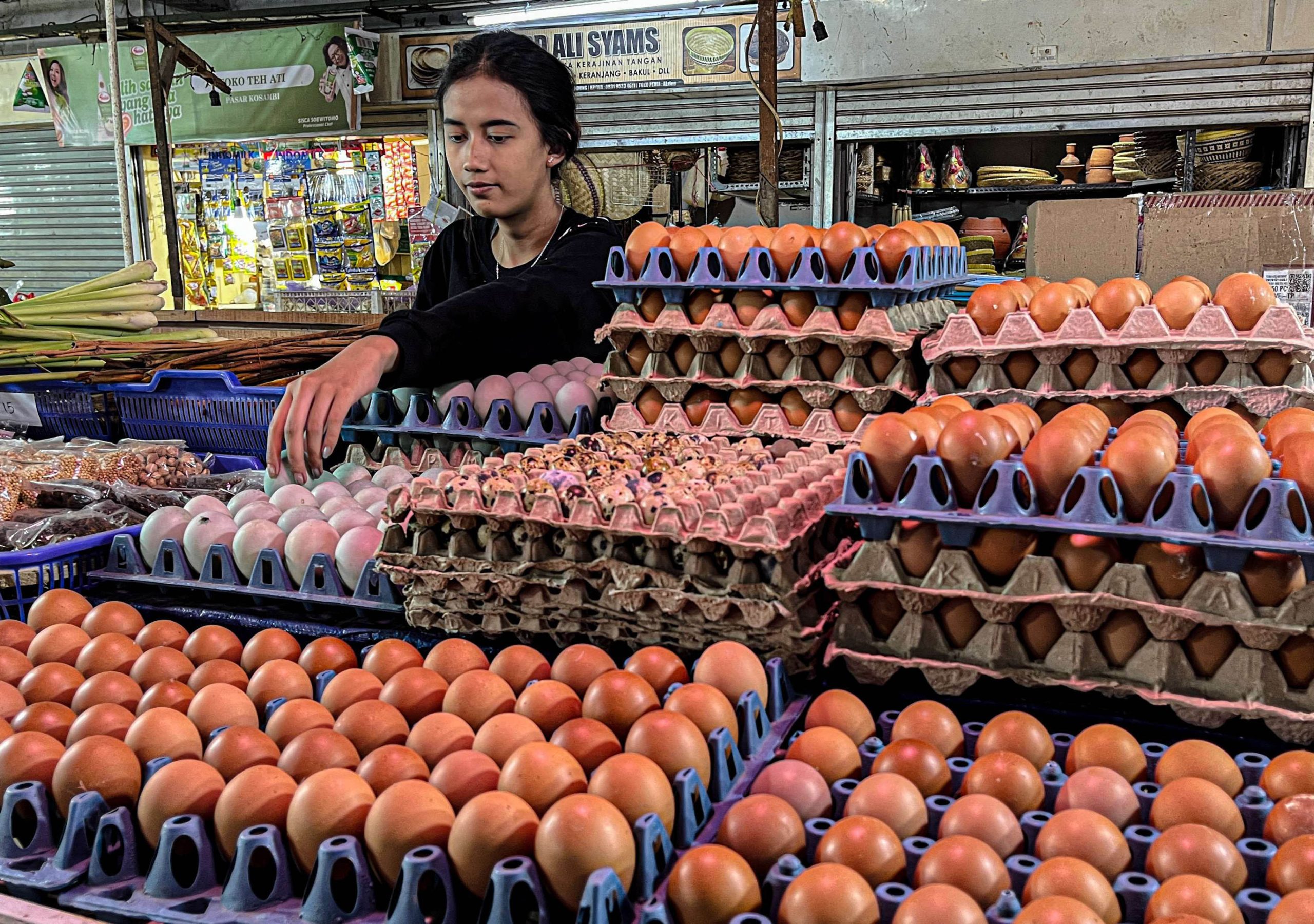 A vendor sorts chicken eggs