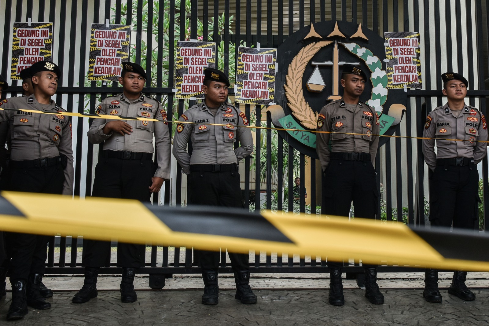 Police officers stand guard