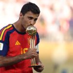 Rodri kisses the Golden Ball trophy