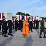 Military officials carry the coffins of soldiers